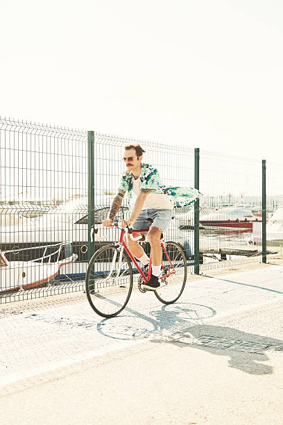 istock Young Hipster Cycling on Marina 537643020
