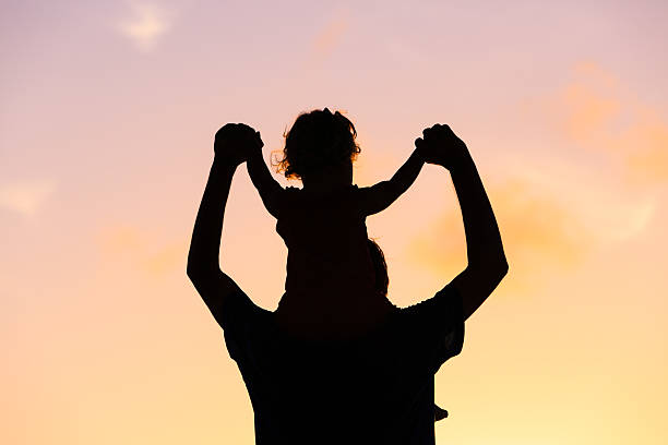istock father and daughter having fun at sunset 537643532
