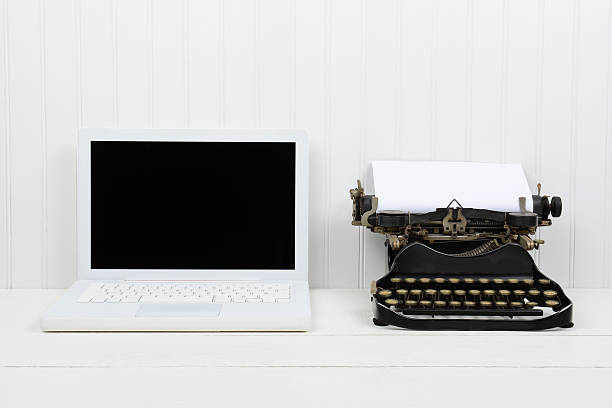 istock Modern Laptop and Antique Typewriter 537643925