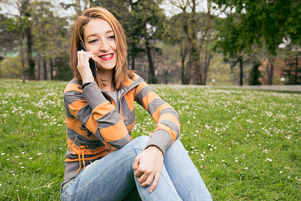 istock Smiling woman talking on smart phone, outdoors. 537644300