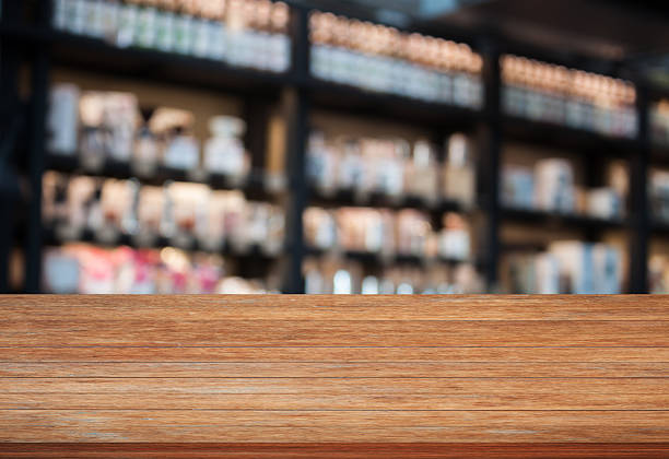 istock Top wooden table in coffee shop blurred background 537645458