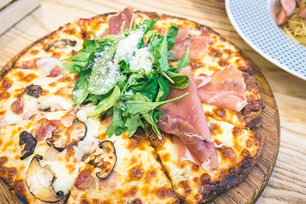 istock Pizza Parma Ham Rocket and Bacon Mushroom 537645480