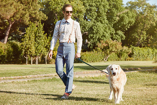 istock Young Hipster Man and Dog at Park 537645736