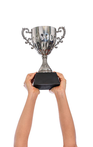 istock Woman two hand holding a champion silver trophy on white 537646398
