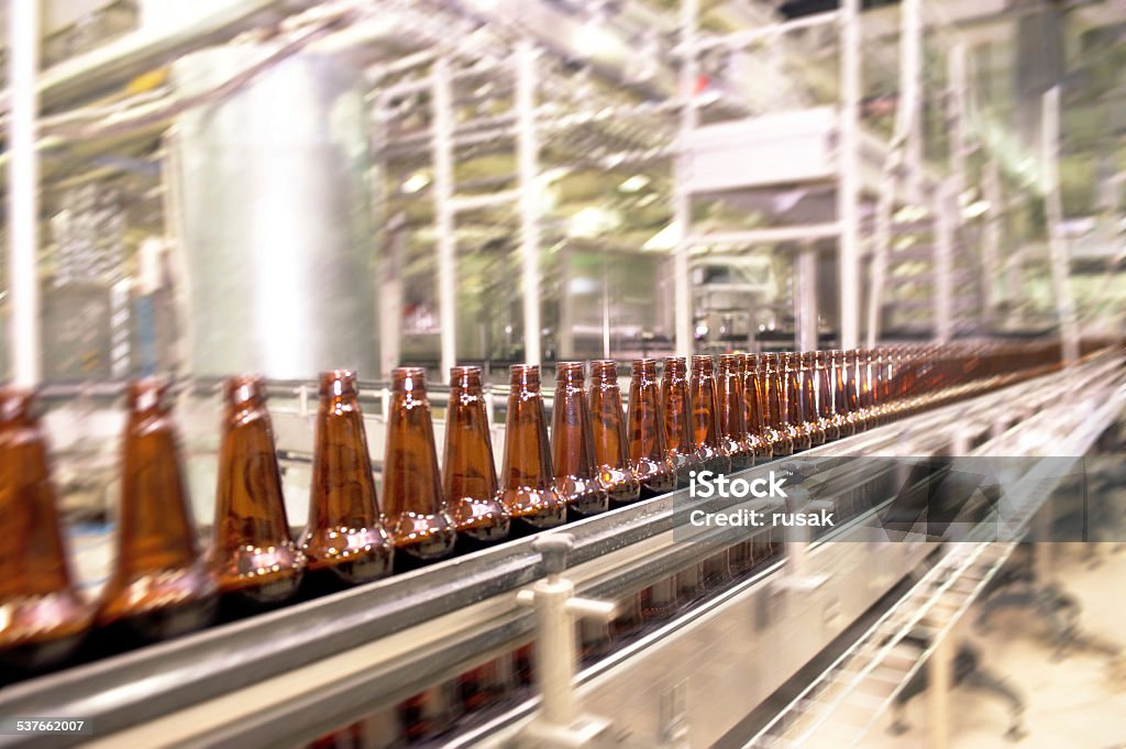 Beer conveyor Beer bottles on the conveyor belt Factory Stock Photo