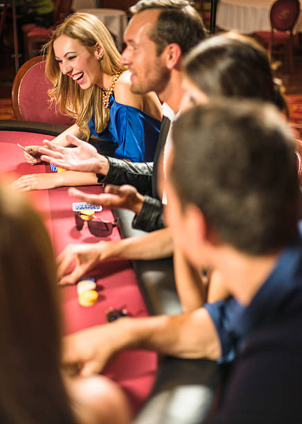 istock Friends playing at poker at Casino 537662079