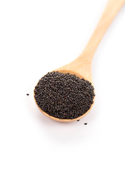 istock sweet basil seeds in wood spoon 537662729
