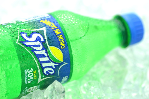 Kwidzyn, Poland - May 26, 2014: Bottle of Sprite drink on ice cubes. Sprite is lemon-like flavored soft drink produced by Coca-Cola Company. Sprite was introduced in 1961