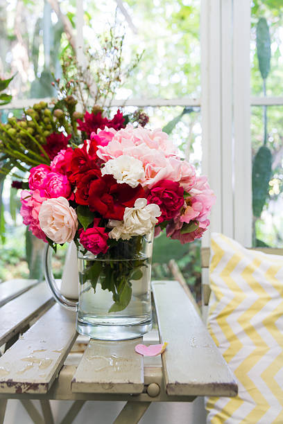 istock colorful rose in glass 537664745