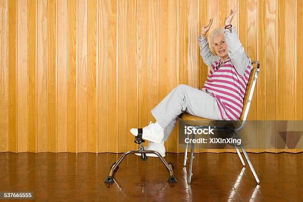 Senior Woman Exercising Stock Photo - Download Image Now - Exercising, Relaxation Exercise, Sitting