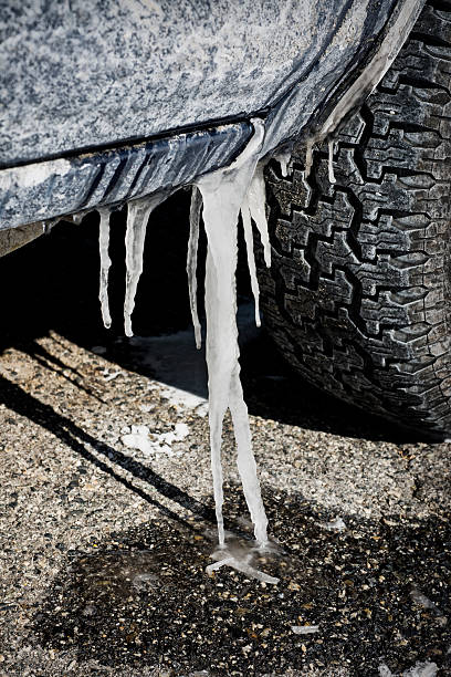 Photo of a frozen car with icicles hanging off the side mirror