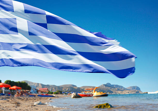 istock Greek flag on the beach in Rhodes 537674485