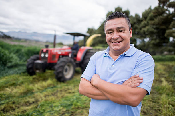 istock Man at a farm with a tractor 537674499