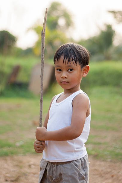 istock happy young asia boy  playing kungfu having fun 537675251