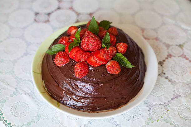 istock Chocolate cake decorated with strawberries on plate 537688570