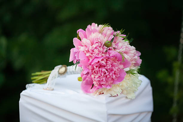 Beautiful wedding bouquet of peons, close up Beautiful wedding bouquet of pink peons, close up peone stock pictures, royalty-free photos & images