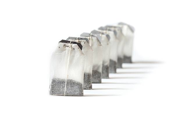 istock Unused teabags in a row isolated on white background 537692320
