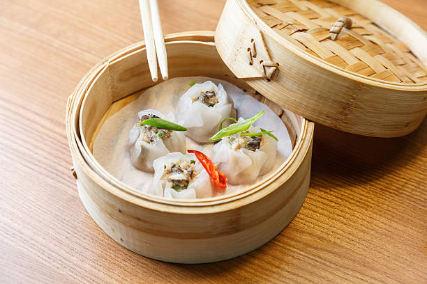 istock Dim sums with pork and mushrooms in asian restaurant 537692702