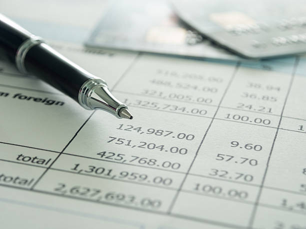 accounts and finance pen and creditcard on report. selective focus. bank account stock pictures, royalty-free photos & images