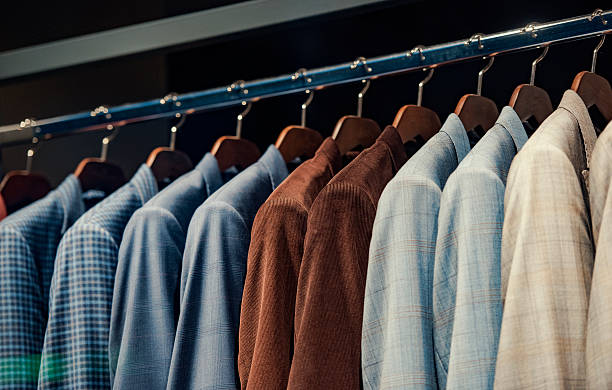 istock Elegant suits in a men clothing store 537694754