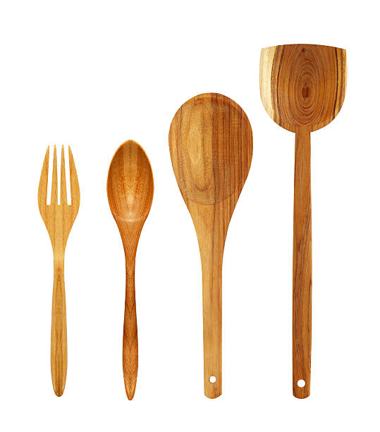 istock wooden spoons and fork isolated on white background 537697054