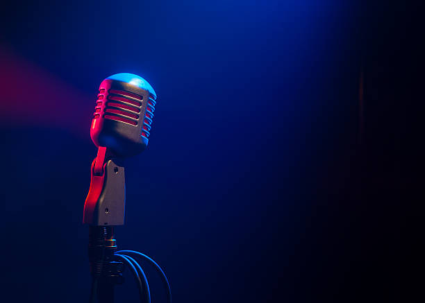 metal microphone in beams of light