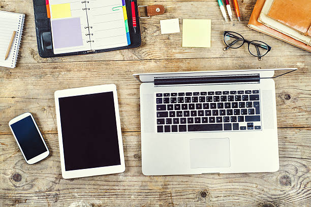 istock Desktop mix on a wooden office table. 537698211