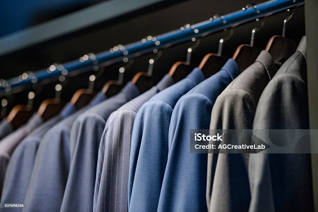 Elegant suits in a men clothing store Businesswear Stock Photo