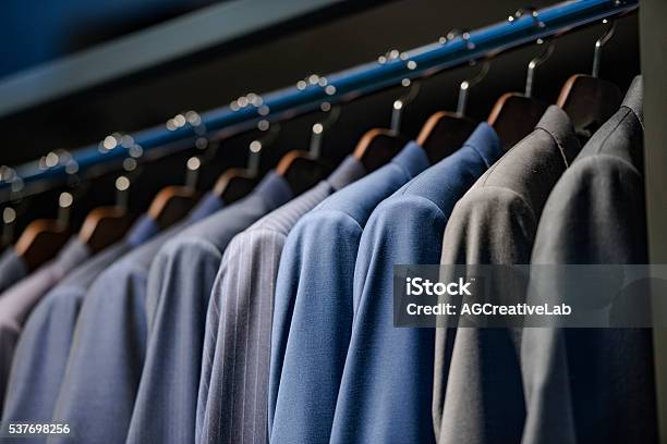 Elegant Suits In A Men Clothing Store Stock Photo - Download Image Now - Businesswear, Hanging, Adult
