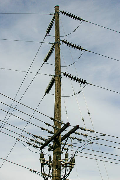 Power Lines being supported by a power pole stock photo