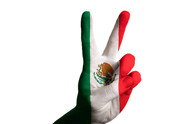 istock mexico national flag two finger up gesture for victory 537699005