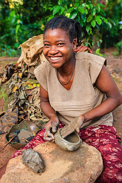 Young Ethiopian woman making pottery in the village in Omo Valley.http://bhphoto.pl/IS/ethiopia_380.jpg
