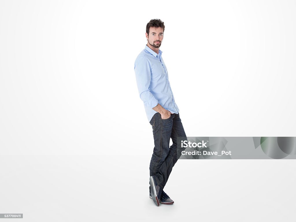 one man leaning against the wall young guy standing in front of a panel Leaning Stock Photo