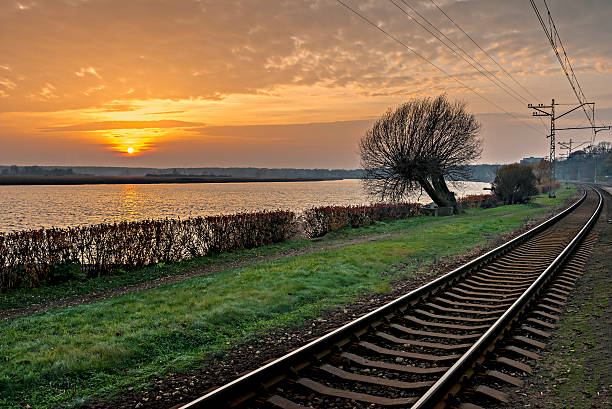 Autumnal view on the river and rails at sunset, Jurmala, Latvia