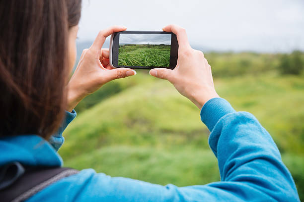 istock Hiker woman taking photographs summer landscape 537701099