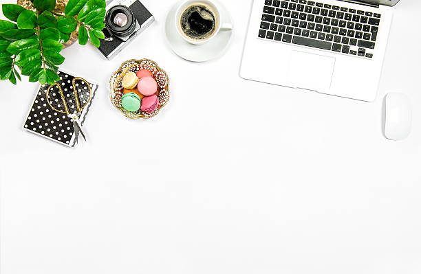 istock Creative feminine workplace. Coffee macaroon cookies laptop 537701282