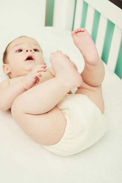 istock Playful baby in cloth diaper 537702675
