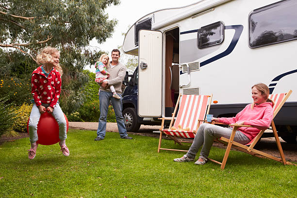 istock Family Enjoying Camping Holiday In Camper Van 537702939