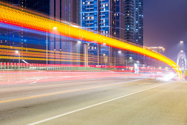 istock city road at night with dramatic light trails 537703225