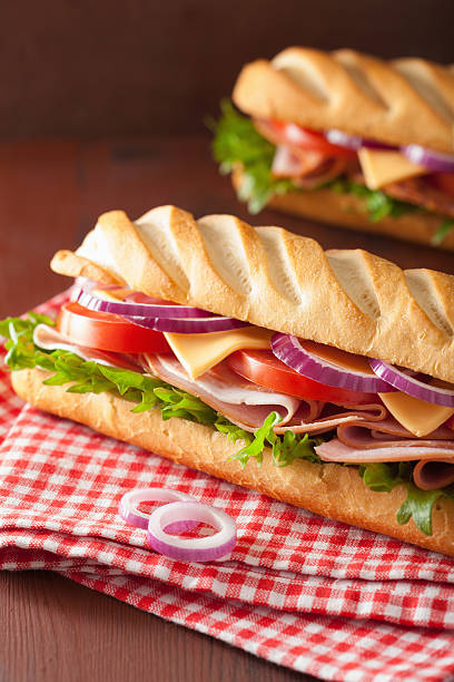 istock long baguette sandwich with ham cheese tomato and lettuce 537703337