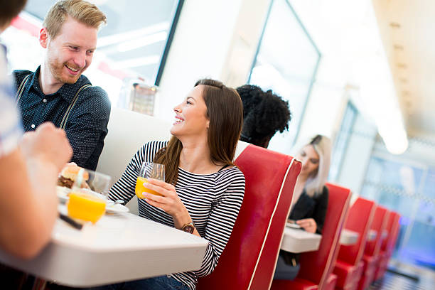 istock Friends eating at the table in the diner 537704046