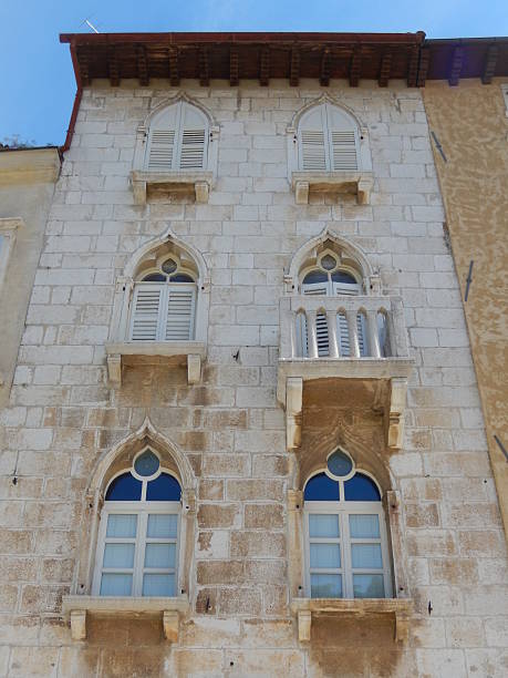 istock OLD VENETIAN WINDOWS ON STONE FACADE, POREC, CROATIA 537704748
