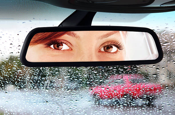 Female race car driver wears helmet and balaclava