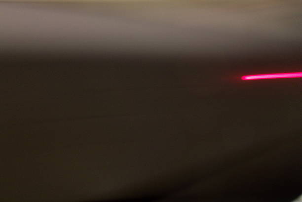 istock Black and Grey Background with Red Light Streak 537708928