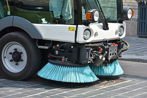Street cleaner vehicle in the city