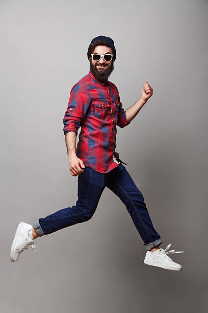 istock happy excited jmping young bearded man 537709864
