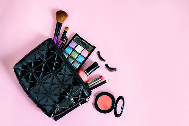 istock make up with cosmetics and brushes isolated on pink background 537710164