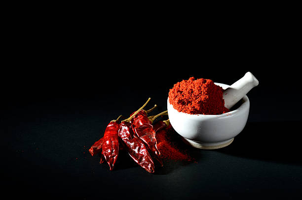istock Red Chili Pepper powder in pestle with mortar 537712038