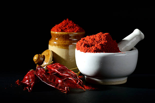 istock Red Chili Pepper powder in pestle with mortar 537712480