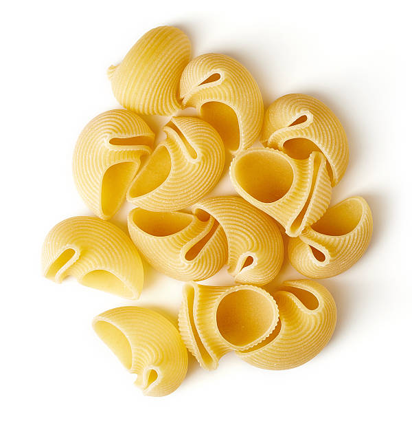istock Lumaconi pasta isolated on white, from above 537712706